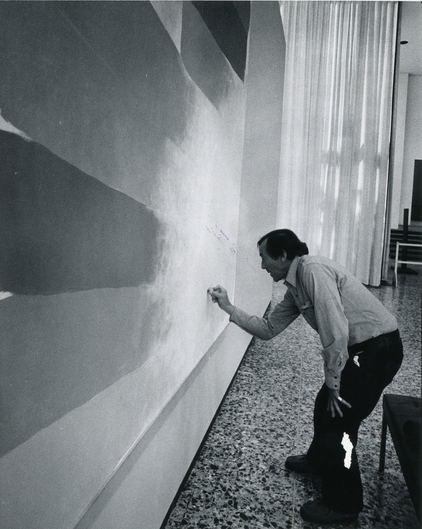 The artist working on the painting&nbsp;Orange Center,&nbsp;1973
